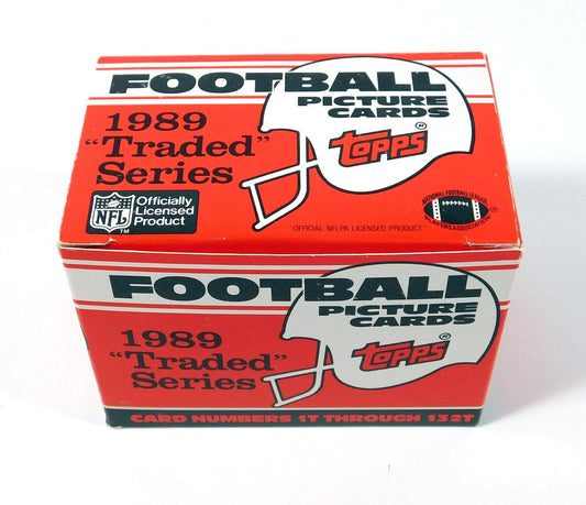 1989 Topps Traded Football Complete Mint 132 Card Set in Original Factory Set Box. Featuring Rookie Cards of Barry Sanders, Troy Aikman, Derrick Thomas, Deion Sanders and Many Others!
